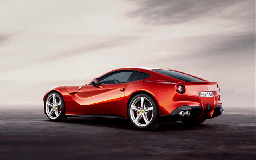 Sleek Ferrari F12 Berlinetta In Action Wallpaper
