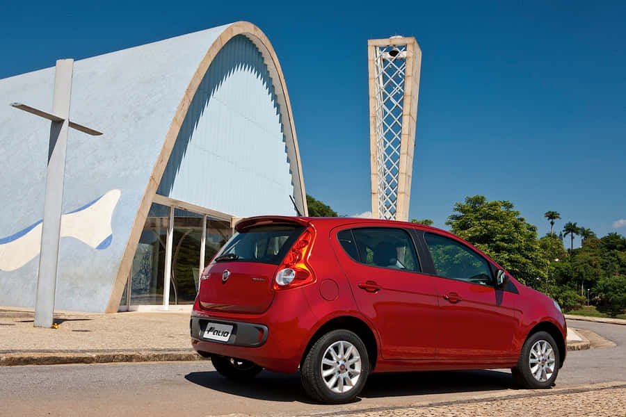 Sleek Fiat Palio In Vibrant Landscape Wallpaper