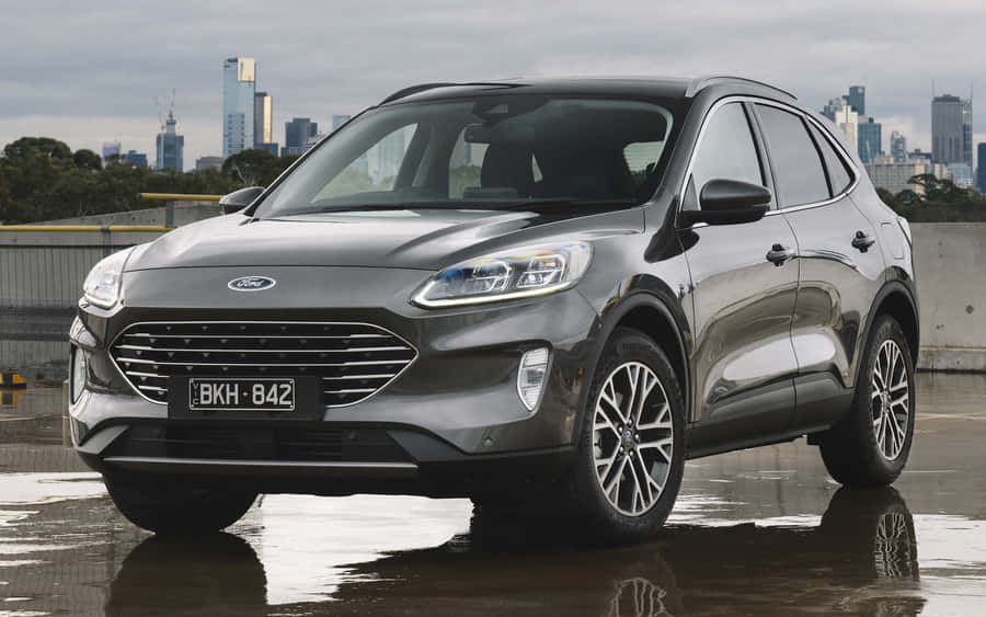 Sleek Ford Escape On A Picturesque Highway Wallpaper