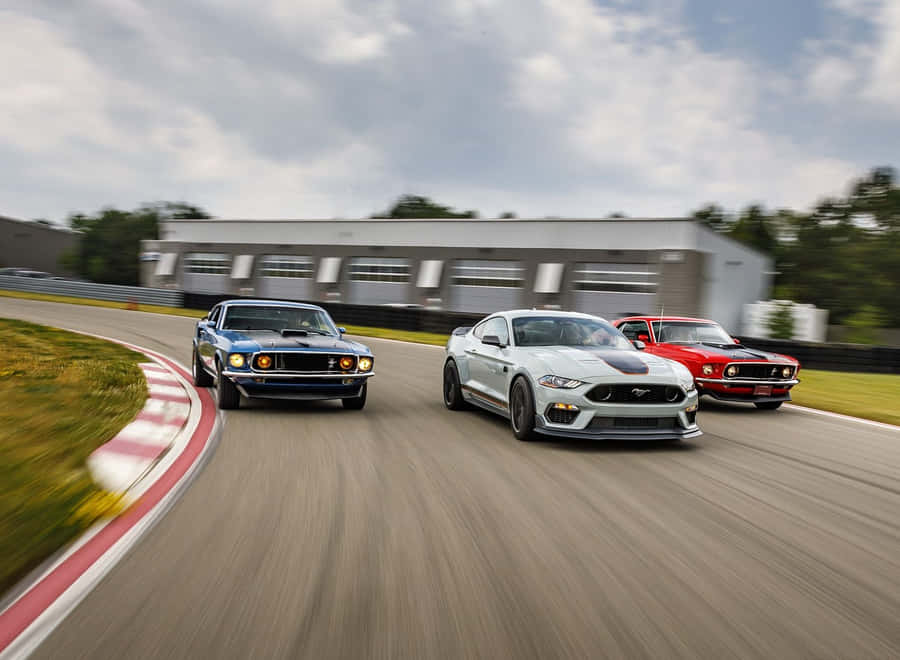 Sleek Ford Mustang Mach 1 Cruising On The Open Road Wallpaper