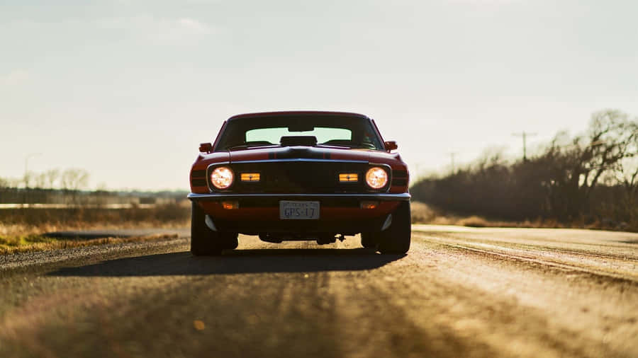 Sleek Ford Mustang Mach 1 In Action Wallpaper