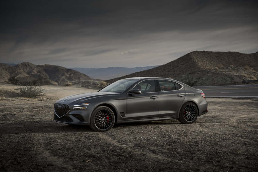 Sleek Genesis G70 Driving Into The Sunset Wallpaper