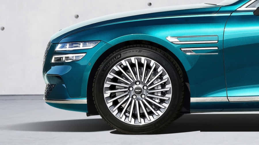 Sleek Genesis Gv60 Electric Vehicle In Motion Wallpaper