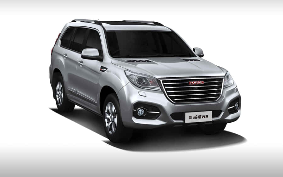 Sleek Haval Suv Cruising Along The Highway Wallpaper