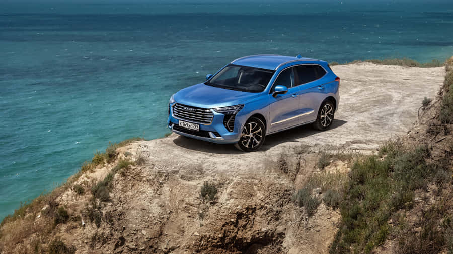 Sleek Haval Suv Cruising On A Scenic Road Wallpaper