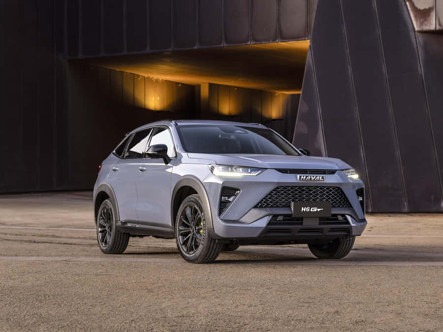 Sleek Haval Suv Cruising Through Urban Landscape Wallpaper