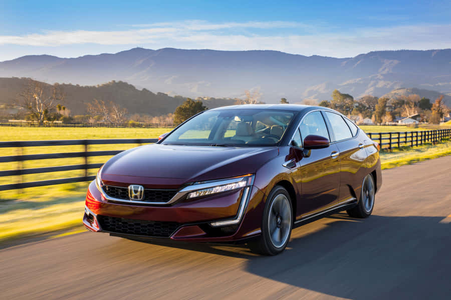 Sleek Honda Clarity In A Scenic Environment Wallpaper