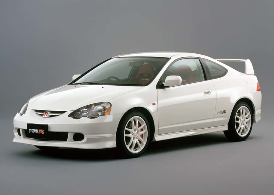 Sleek Honda Integra In A Beautiful Outdoor Setting Wallpaper