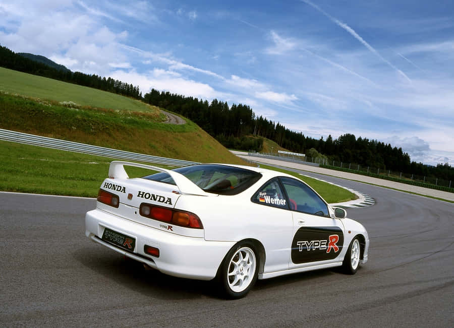Sleek Honda Integra In Action Wallpaper