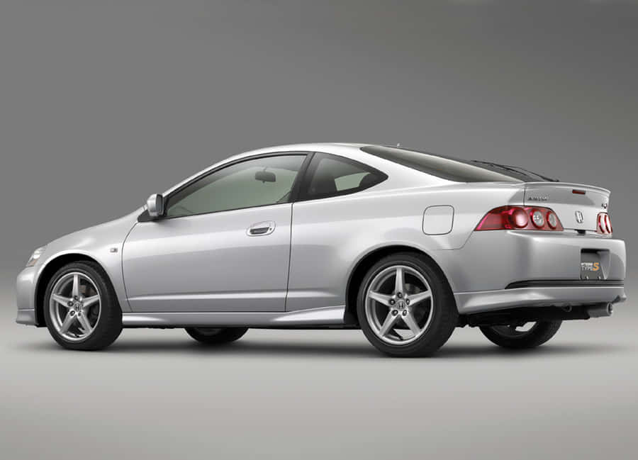 Sleek Honda Integra On The Road Wallpaper