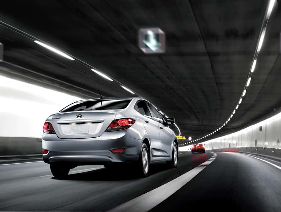 Sleek Hyundai Accent On The Road Wallpaper