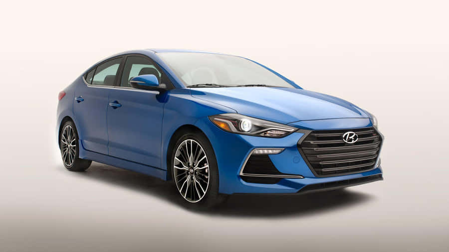 Sleek Hyundai Elantra In Cityscape Wallpaper