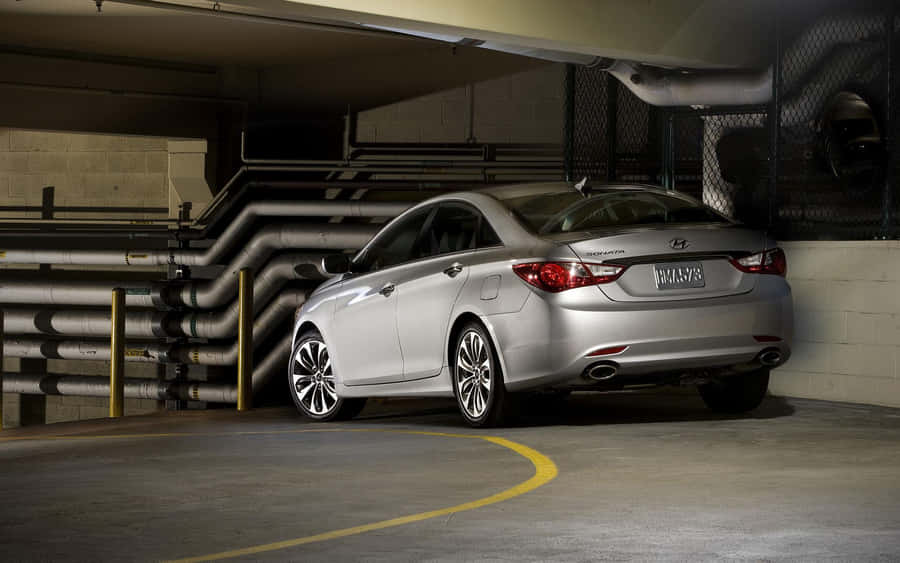 Sleek Hyundai Sonata On Scenic Mountain Road Wallpaper