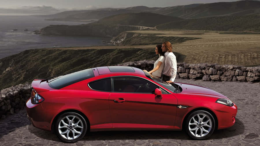 Sleek Hyundai Tiburon On The Road Wallpaper