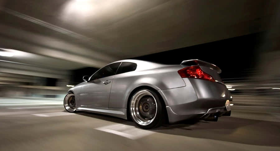 Sleek Infiniti G35 Cruising On The Open Road Wallpaper
