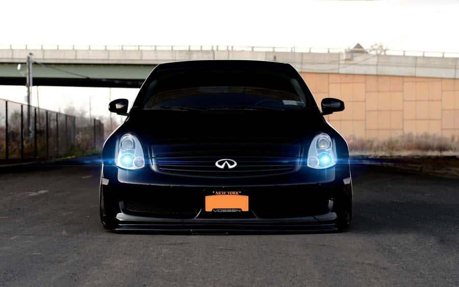 Sleek Infiniti G35 In Scenic City Setting Wallpaper