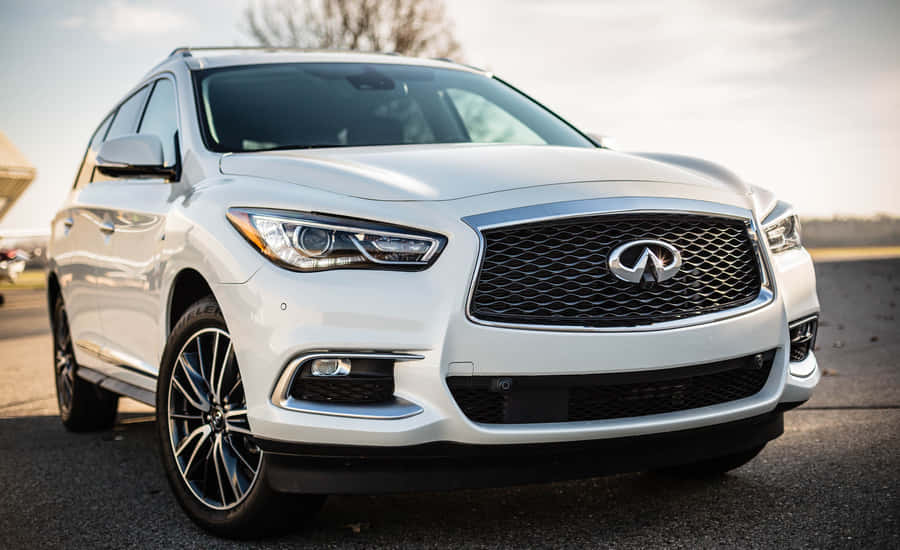 Sleek Infiniti Qx60 On The Road Wallpaper