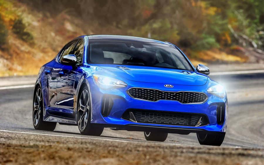 Sleek Kia Stinger On The Open Road Wallpaper