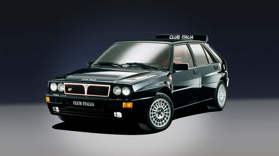 Sleek Lancia Car In Urban Environment Wallpaper