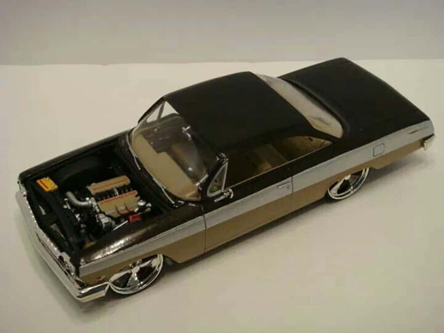 Sleek Luxury Car Model In Studio Setting Wallpaper