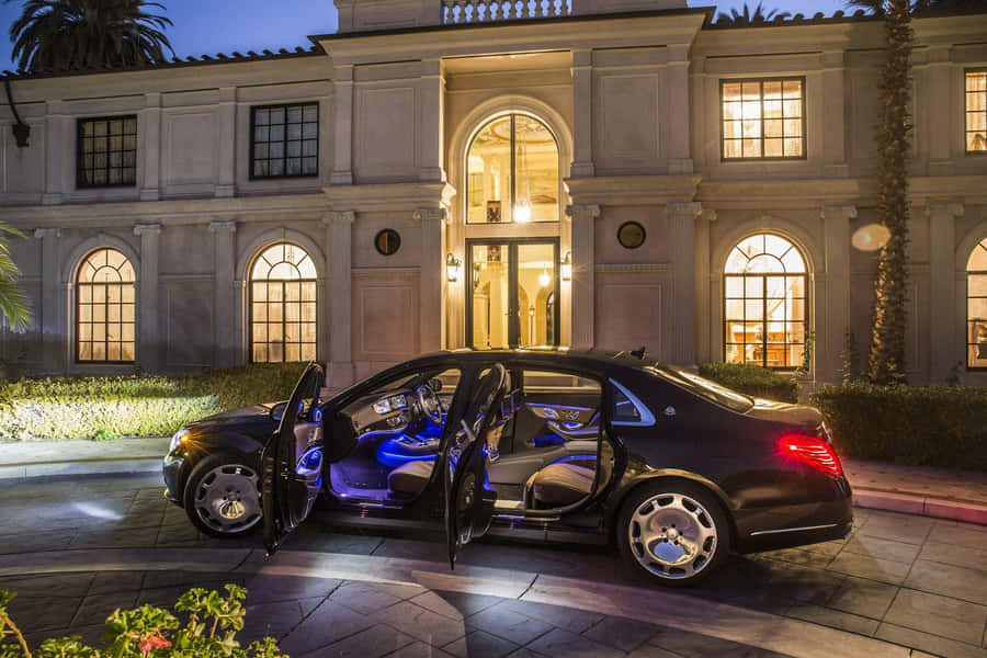 Sleek Maybach Luxury Vehicle Showcased In A Modern Garage Wallpaper