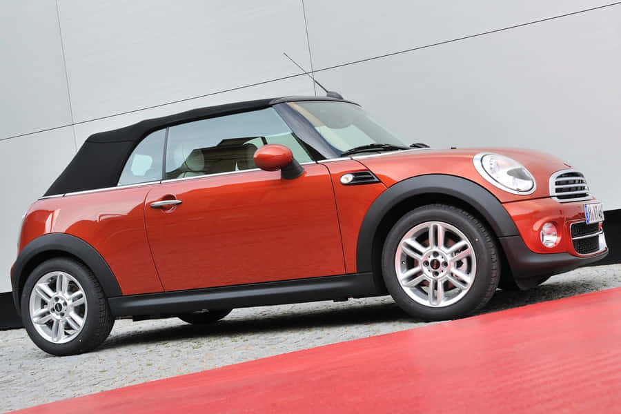 Sleek Mini Cooper Convertible On A Scenic Drive Wallpaper