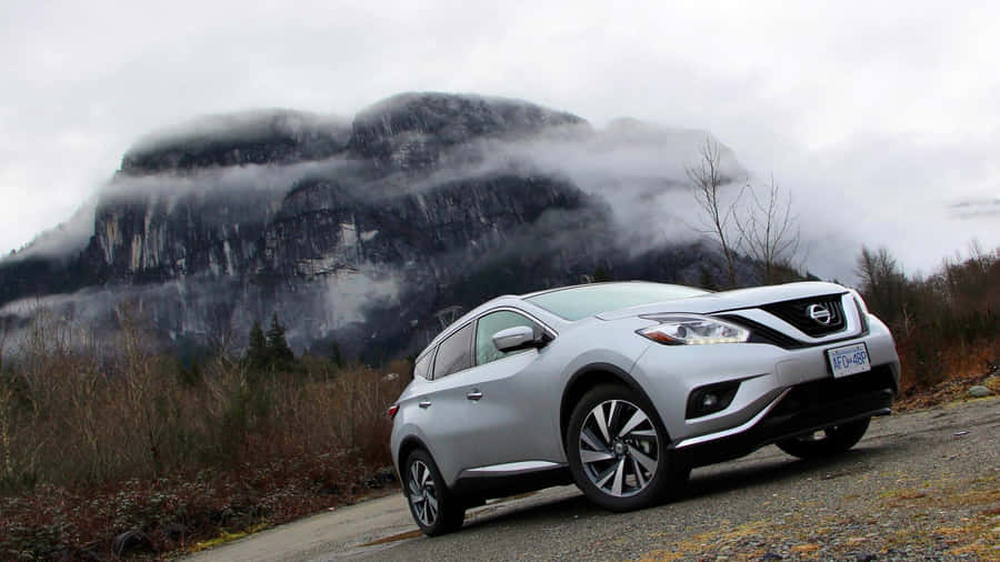 Sleek Nissan Murano Cruising Down A Beautiful Scenic Road Wallpaper