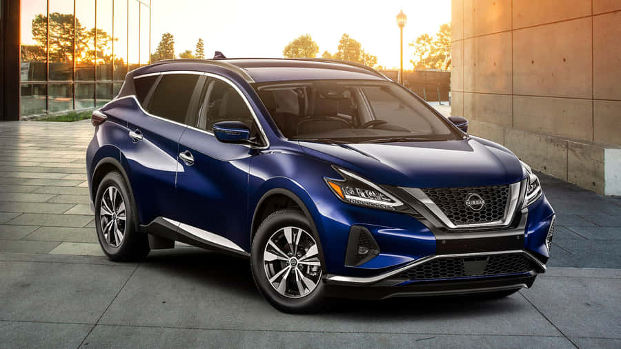 Sleek Nissan Murano Cruising On A Scenic Road Wallpaper