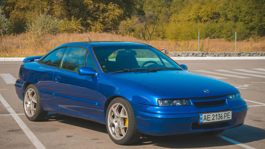 Sleek Opel Calibra Striking Pose In Monochrome Wallpaper
