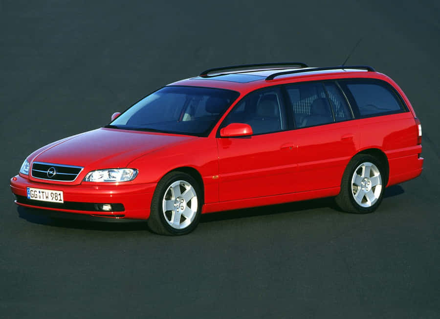 Sleek Opel Omega In Downtown Street Wallpaper
