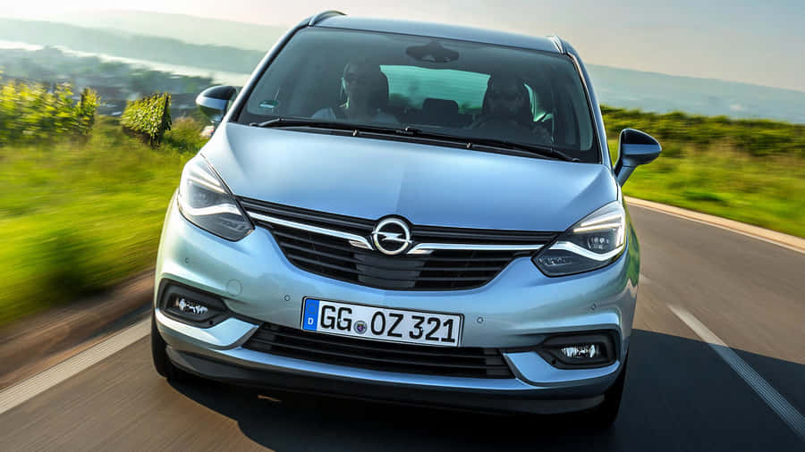 Sleek Opel Zafira Tourer In Motion Wallpaper
