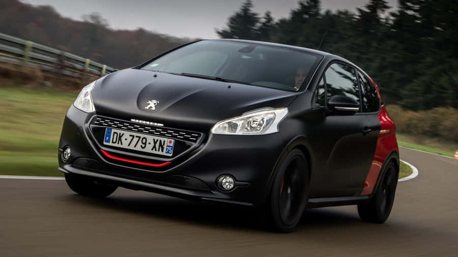 Sleek Peugeot 208 In Action Wallpaper