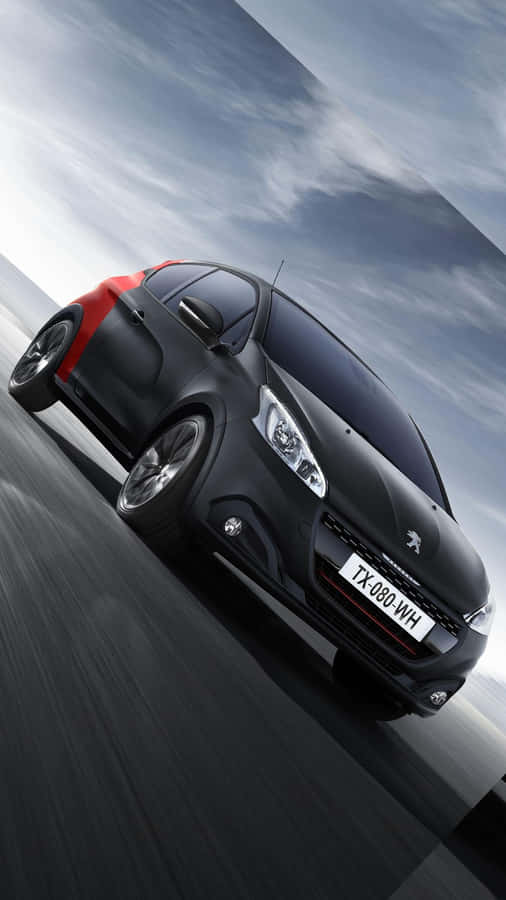 Sleek Peugeot 208 In Action Wallpaper