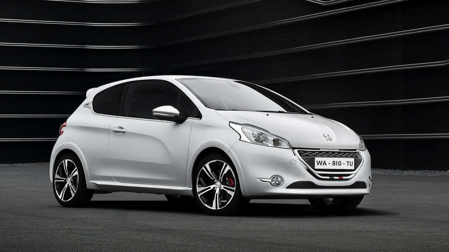 Sleek Peugeot 208 In Stunning Urban Environment Wallpaper