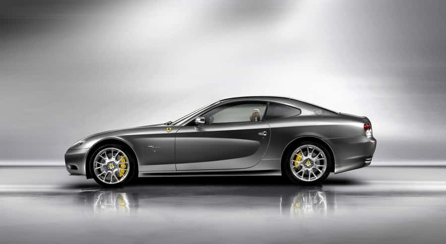 Sleek Red Ferrari 612 Scaglietti In A High-resolution Wallpaper Wallpaper