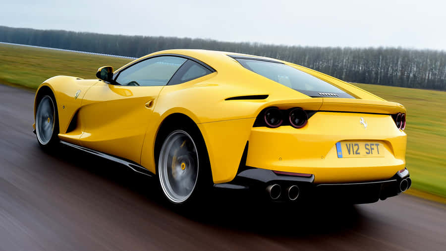 Sleek Red Ferrari 812 Superfast In Action Wallpaper