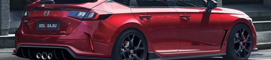 Sleek Red Hatchback On Road Wallpaper