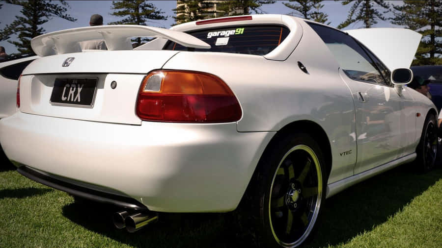 Sleek Red Honda Civic Del Sol In Nature Wallpaper