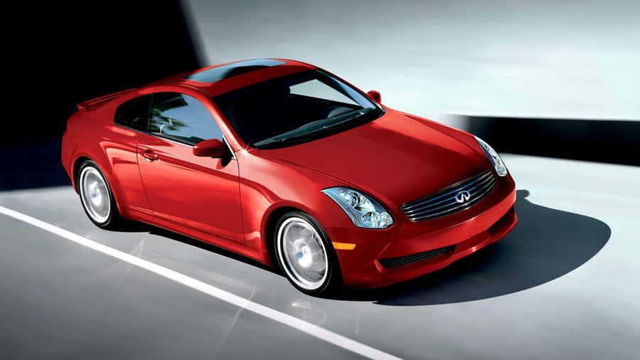 Sleek Red Infiniti G35 Sports Car On The Road Wallpaper
