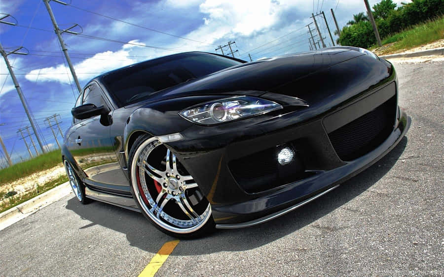 Sleek Red Mazda Rx-8 Sports Car Wallpaper