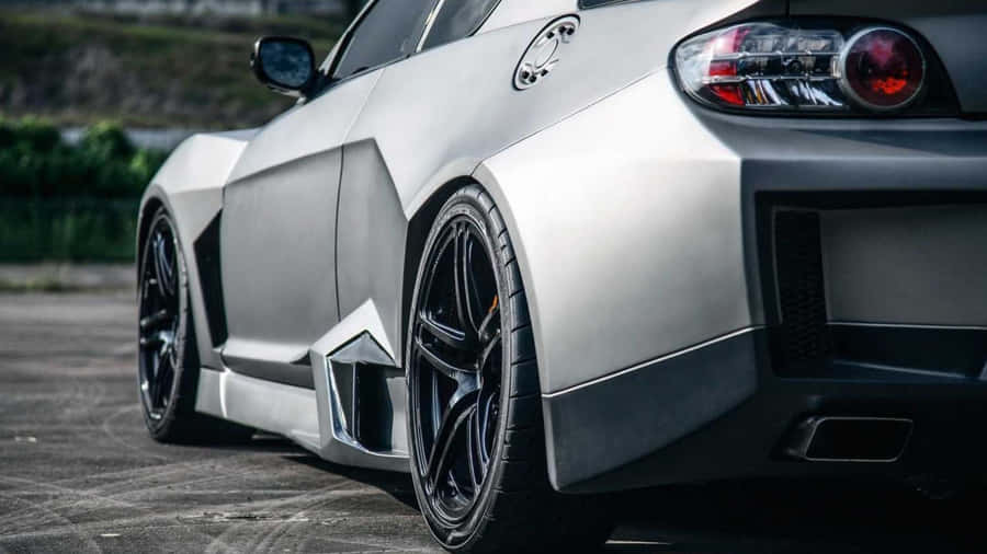 Sleek Red Mazda Rx-8 Sports Car On A Scenic Country Road Wallpaper