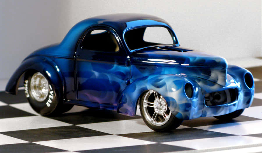 Sleek Red Sports Car On Open Road Wallpaper