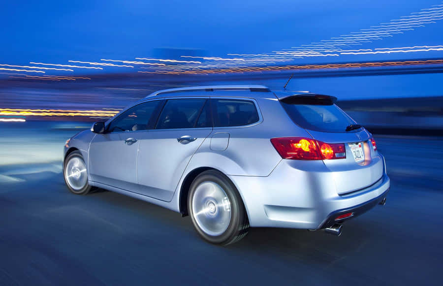 Sleek Silver Acura Tsx On Street Wallpaper