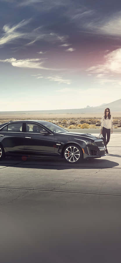 Sleek Silver Cadillac Cts On A Scenic Road Wallpaper
