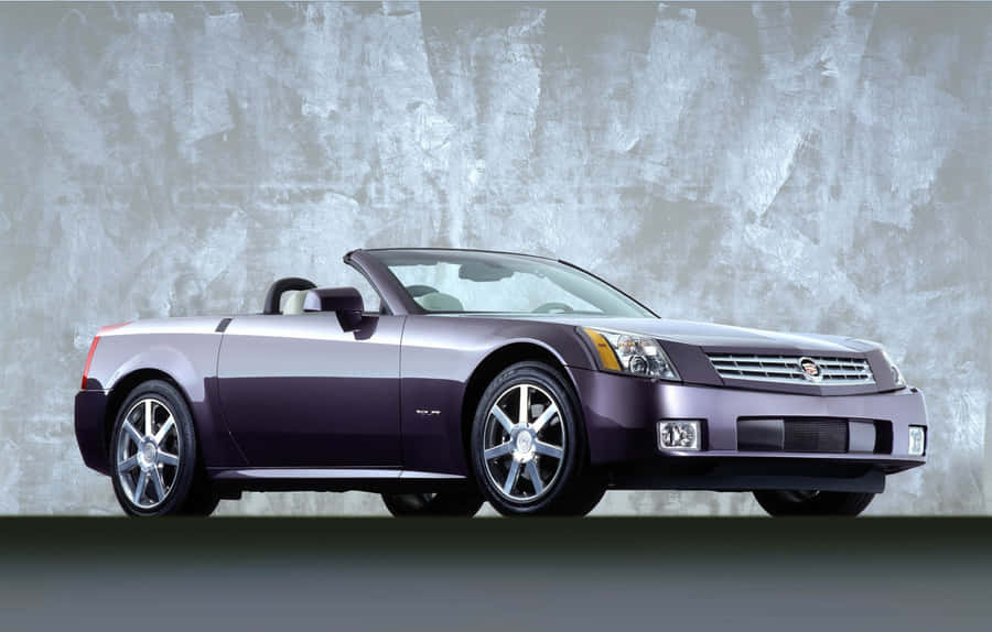 Sleek Silver Cadillac Xlr Cruising In Style Wallpaper