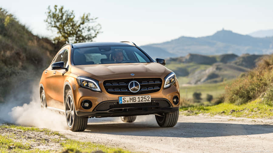 Sleek Silver Mercedes Benz Gla-class Parked On An Urban Street Wallpaper