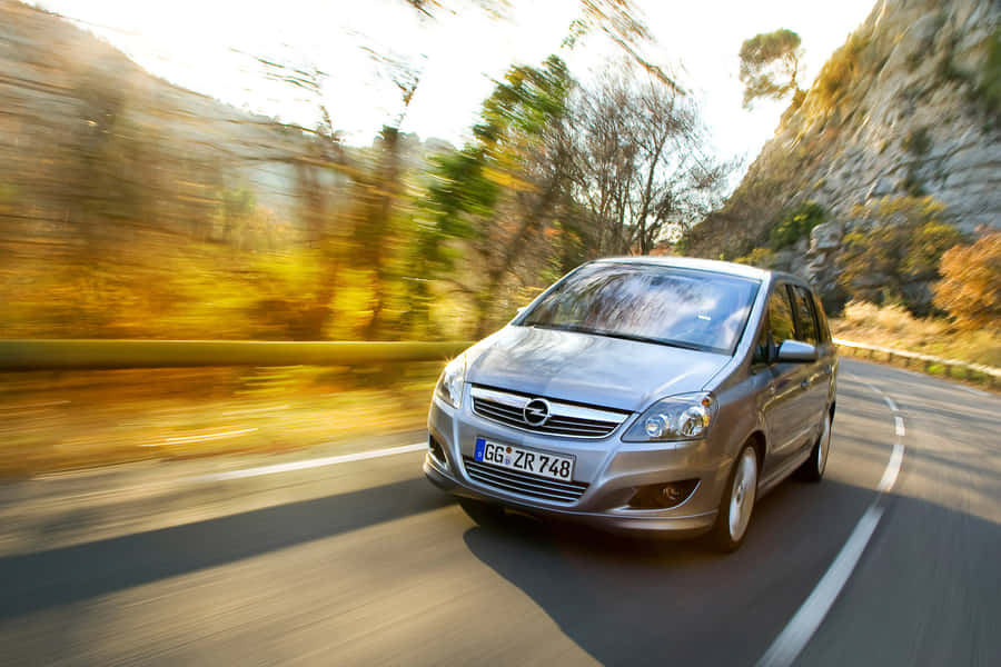 Sleek Silver Opel Zafira On The Road Wallpaper
