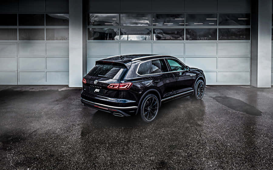 Sleek Volkswagen Touareg In Outdoor Setting Wallpaper