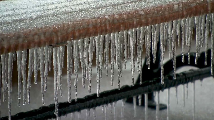 Sleet Forming Under A Wooden Bench Wallpaper