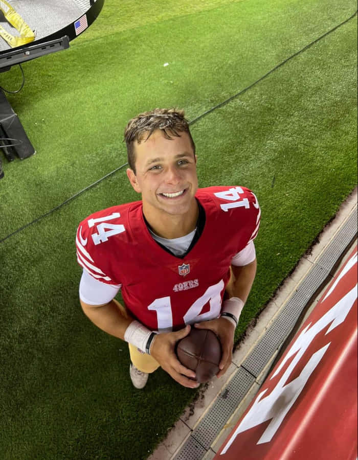 Smiling Football Player Number14 Wallpaper